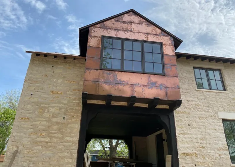 Copper metal panel facade on a stone building for Metal Roof Coating in Brooklyn Park