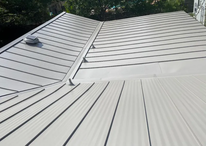 Solar attic fan installed on a metal roof for Roof Ventilation in Brooklyn Park